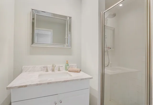 a bathroom with a sink and mirror