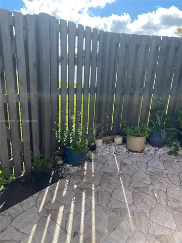 a view of a backyard of the house