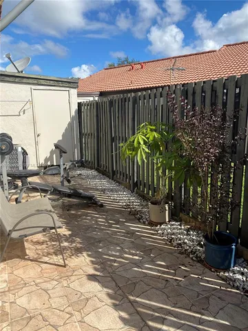 a view of a wooden door with a yard