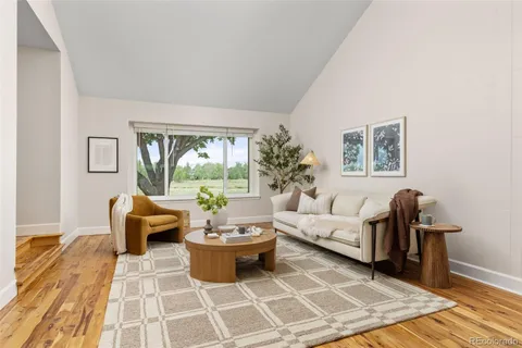 a living room with furniture and a rug