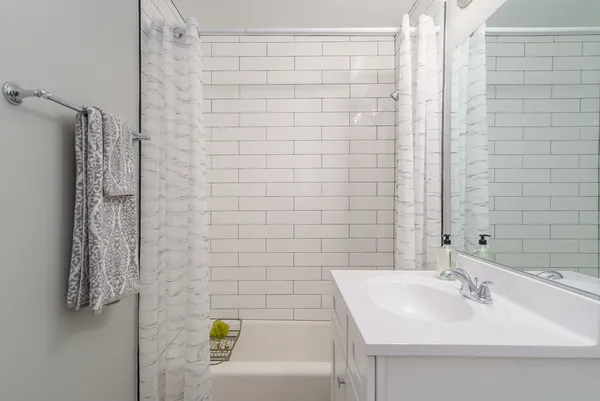 a bathroom with a sink and a shower