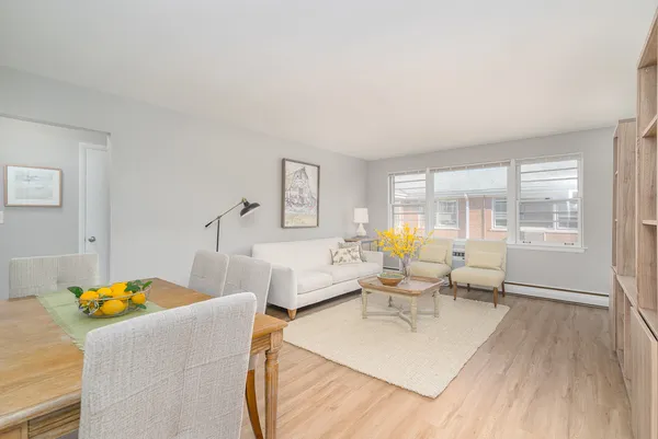 a living room with furniture and a lamp