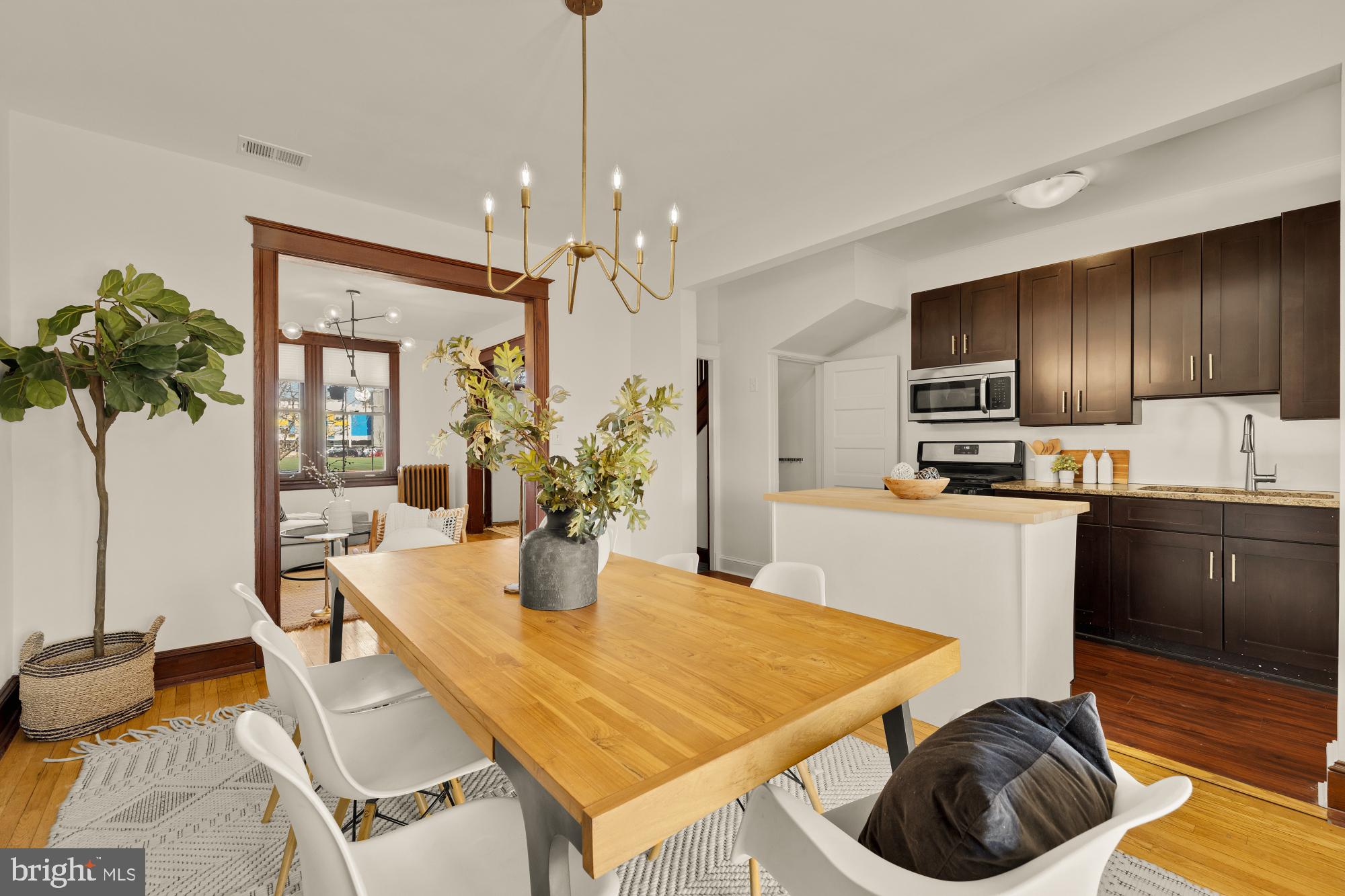 720 Webster Street Northwest Washington, DC 20011 - Photo 11 of 51 a kitchen with granite countertop kitchen island stainless steel appliances a sink microwave and stove
