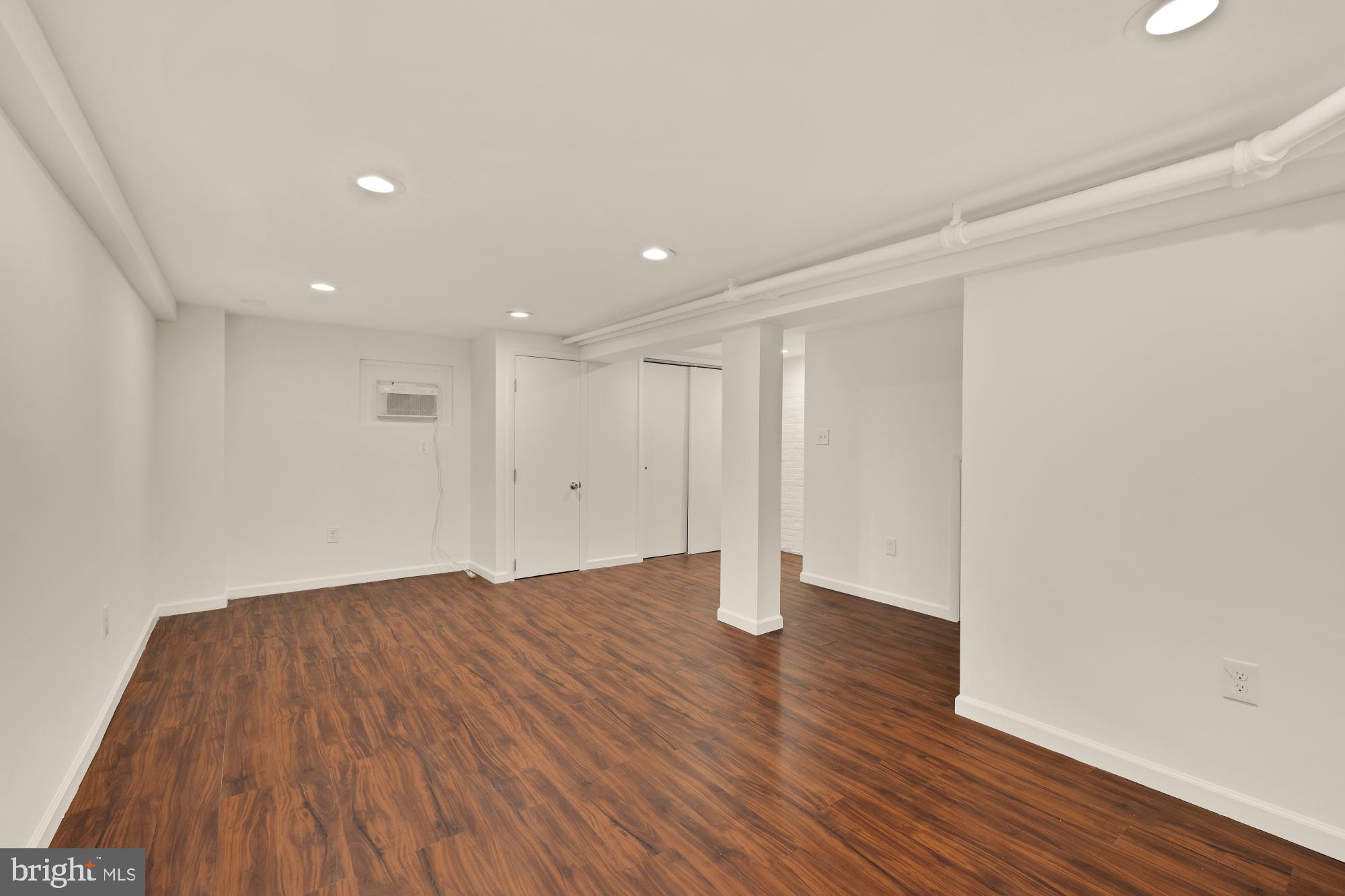 720 Webster Street Northwest Washington, DC 20011 - Photo 32 of 51 a view of an empty room with wooden floor