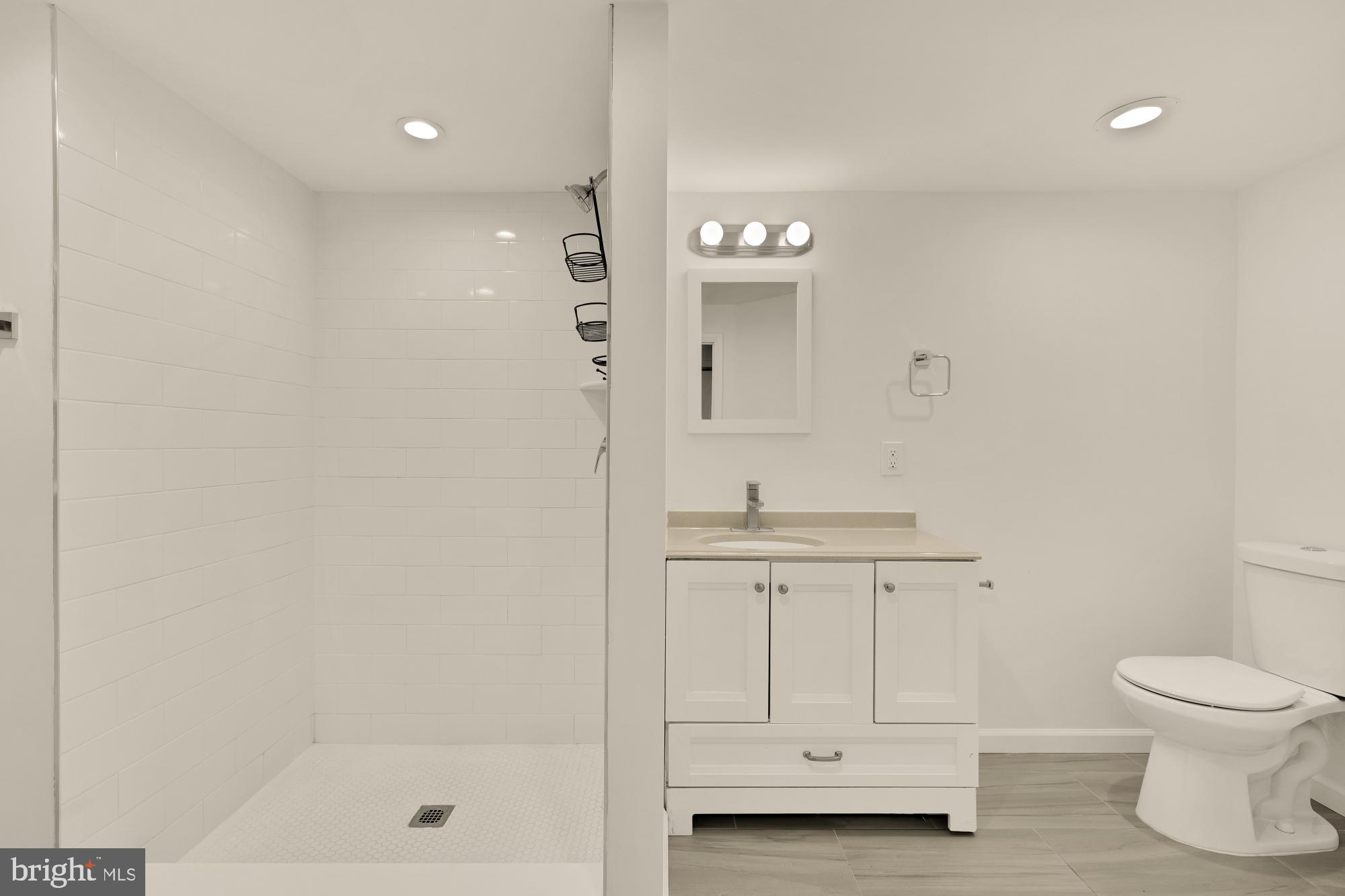 720 Webster Street Northwest Washington, DC 20011 - Photo 33 of 51 a bathroom with a shower a toilet and a sink