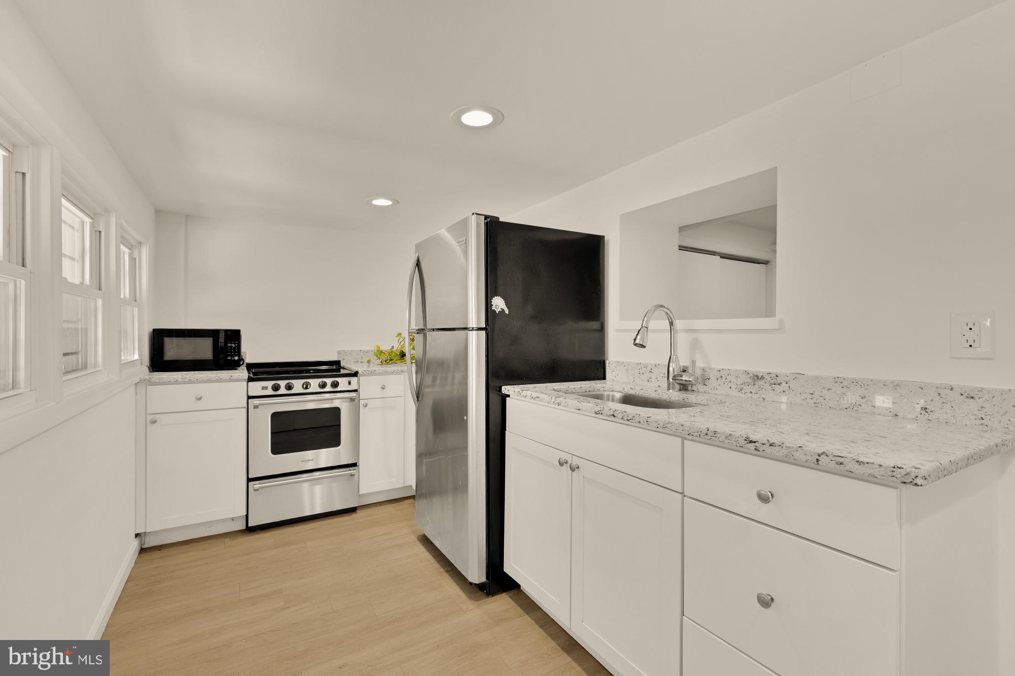 720 Webster Street Northwest Washington, DC 20011 - Photo 35 of 51 a kitchen with appliances cabinets and a sink