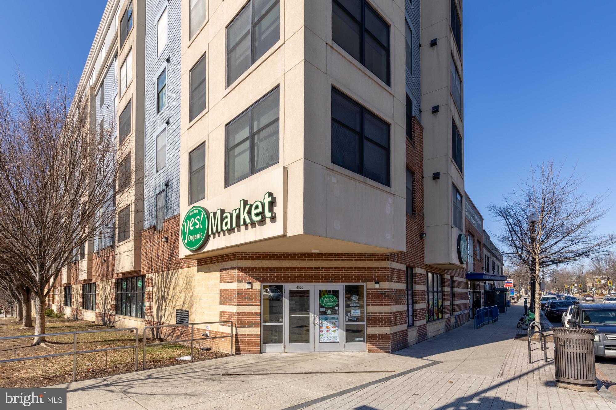 720 Webster Street Northwest Washington, DC 20011 - Photo 45 of 51 a view of a building with a street sign and a large tree