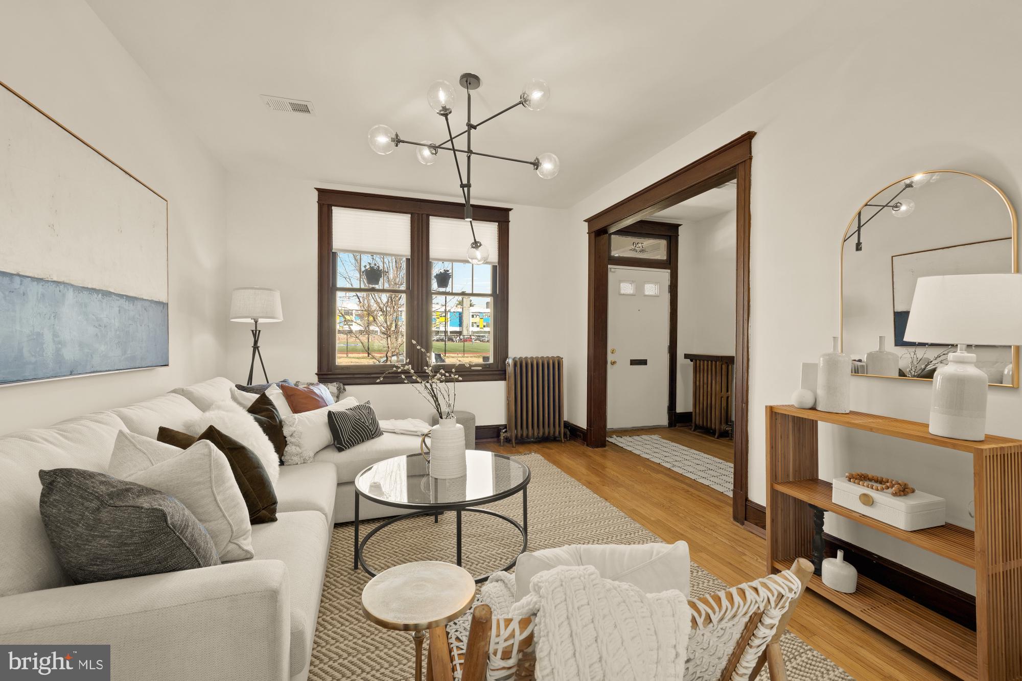 720 Webster Street Northwest Washington, DC 20011 - Photo 8 of 51 a living room with furniture chandelier and a window