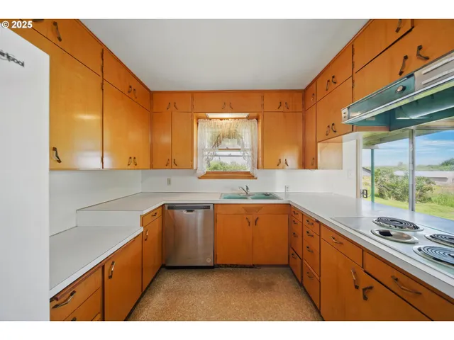 a kitchen with sink and window