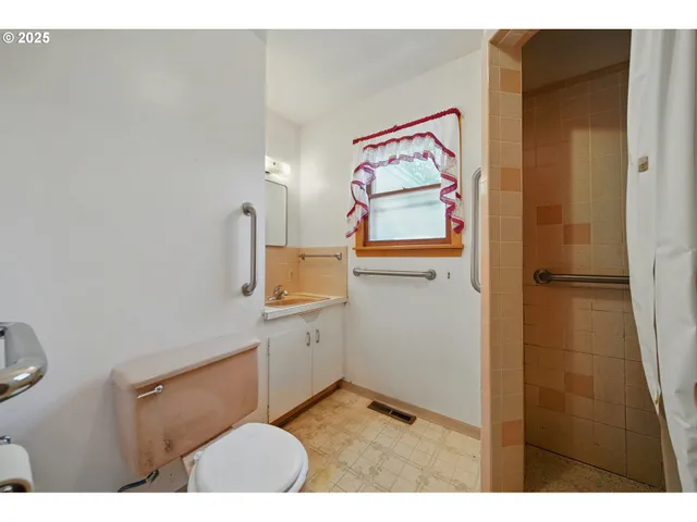 a bathroom with a double vanity sink and a bathtub