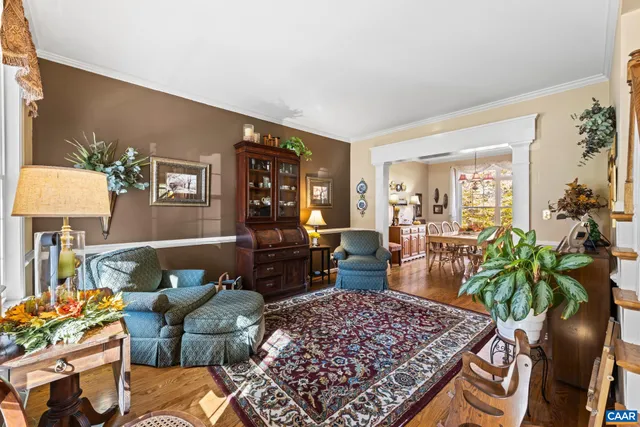 a living room with furniture and a table