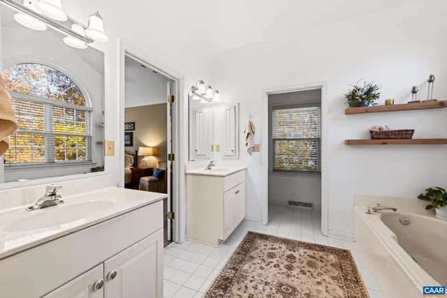 a living room with furniture a window and a flat screen tv