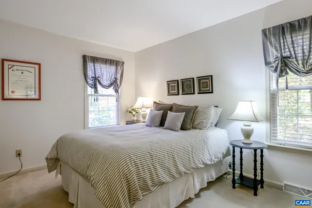 a bathroom with a sink vanity mirror and toilet
