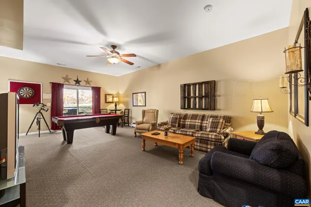a view of a house with a iron stairs and a large tree
