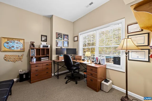 a view of a deck with two chairs and a table