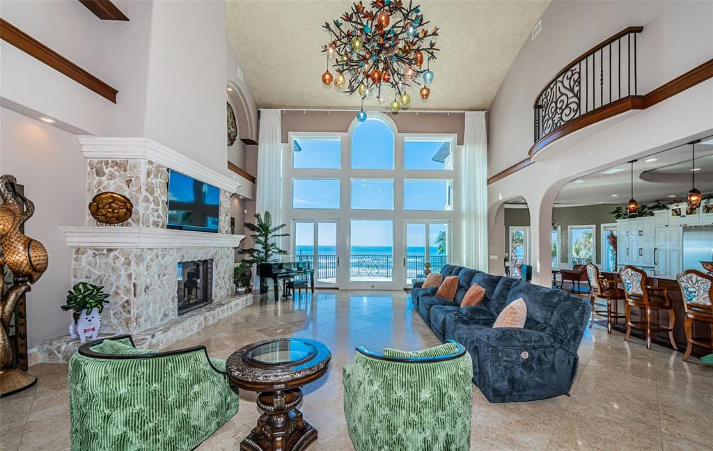 15912 Gulf Boulevard Redington Beach, FL 33708 - Photo 12 of 100 a living room with fireplace furniture and a large window