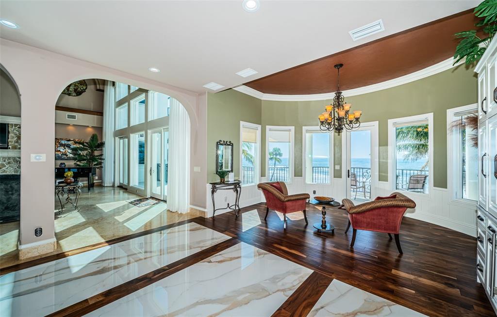 15912 Gulf Boulevard Redington Beach, FL 33708 - Photo 34 of 100 a living room with furniture and floor to ceiling windows