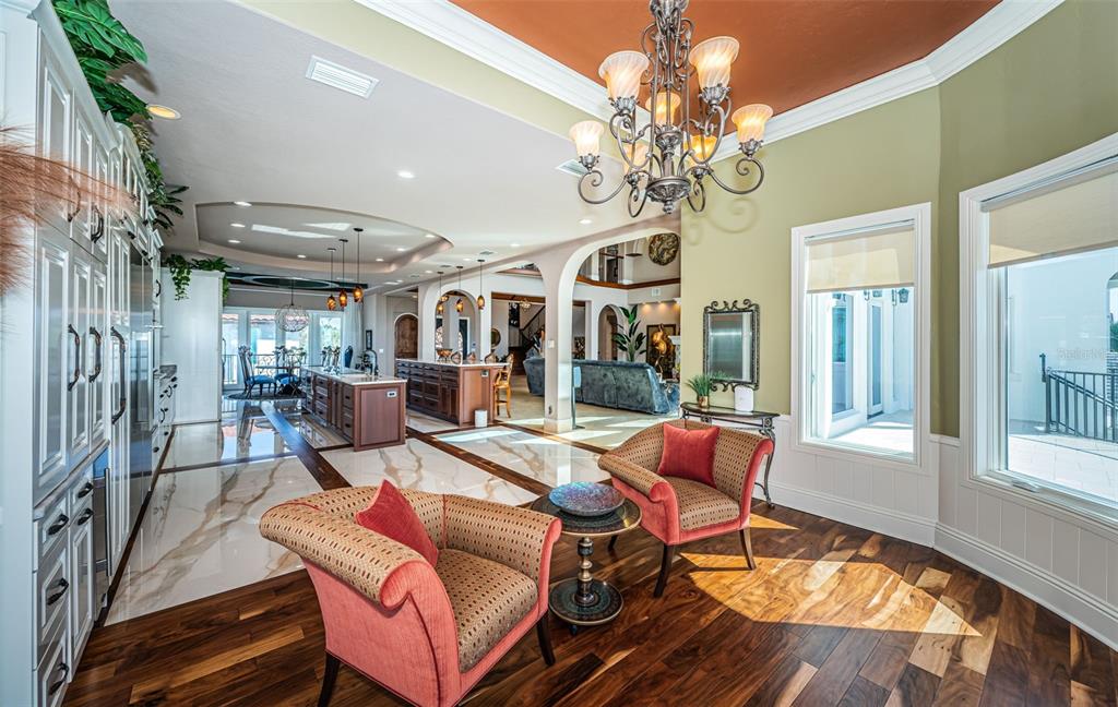 15912 Gulf Boulevard Redington Beach, FL 33708 - Photo 47 of 100 a living room with furniture a chandelier and a rug