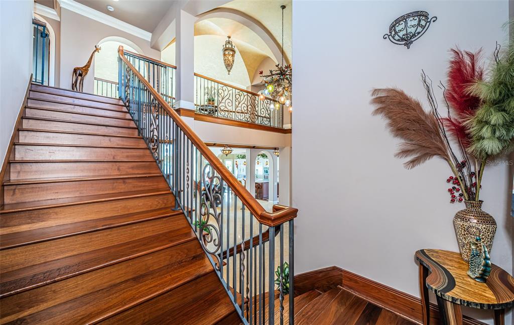 15912 Gulf Boulevard Redington Beach, FL 33708 - Photo 53 of 100 a view of staircase with wooden floor and a potted plant