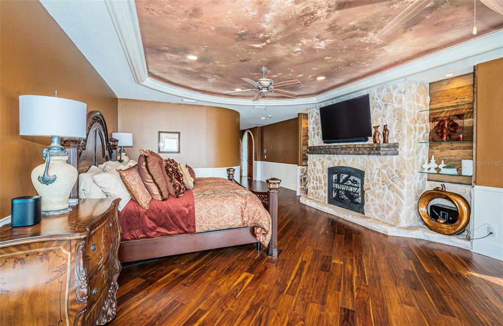 15912 Gulf Boulevard Redington Beach, FL 33708 - Photo 67 of 100 a bedroom with a bed and a flat screen tv
