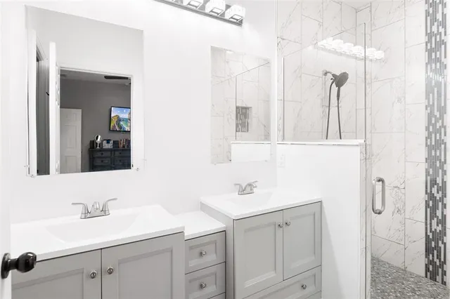 a bathroom with a sink and a mirror