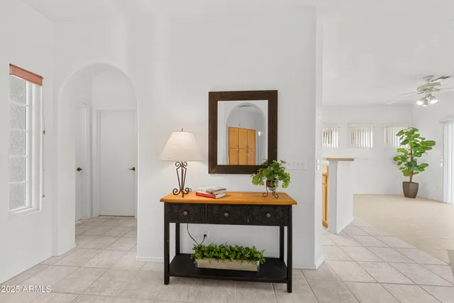 a view of a kitchen with a refrigerator and a chandelier