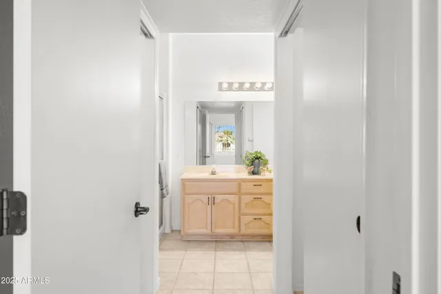 a bathroom with a double vanity sink and a mirror
