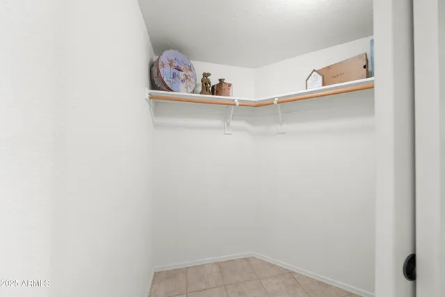 a view of a hallway with shower and wooden floor