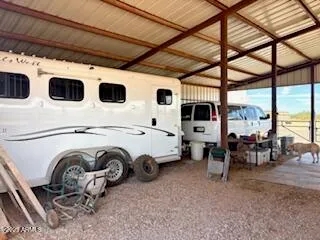 a living room with furniture and a dining table
