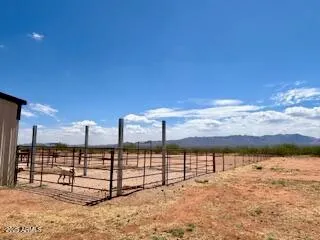 a bedroom with two beds and a couch