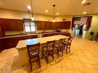 a view of a hallway with wooden floor and furniture