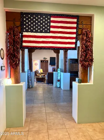 a bedroom with a bed and painting on the wall