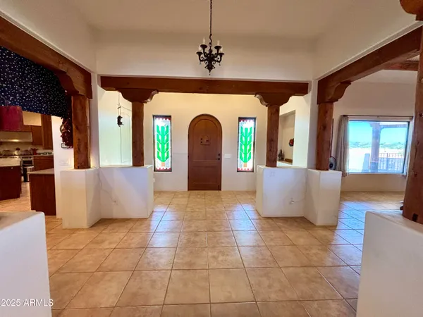 a large bedroom with a bed and a dresser in it