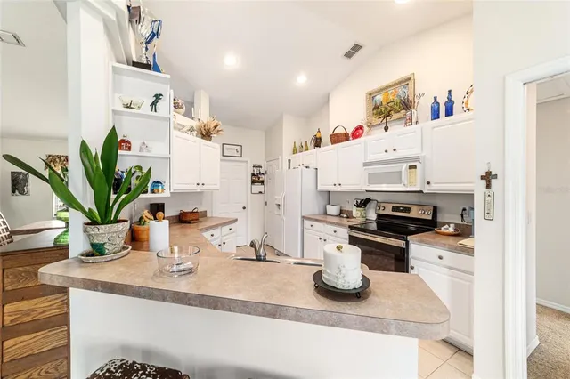 a bathroom with a tub a sink and a shower