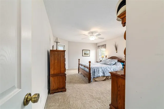 a bedroom with furniture and a window