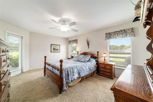 a bedroom with a bed and a table in it