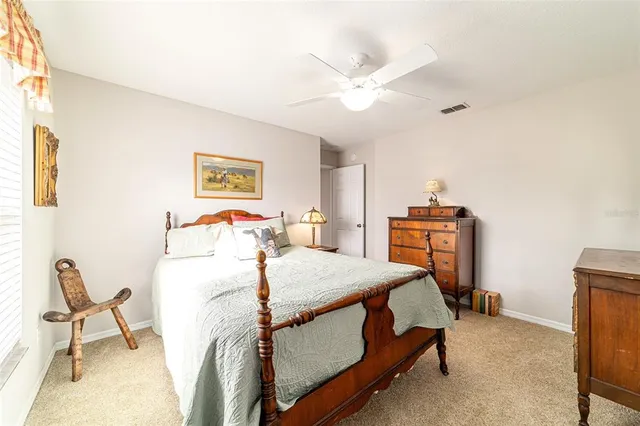 a large house with a big yard and large tree