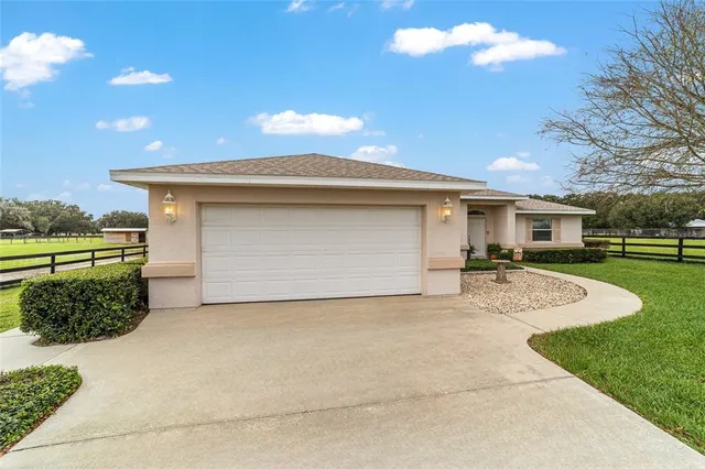 a front view of a house with garage
