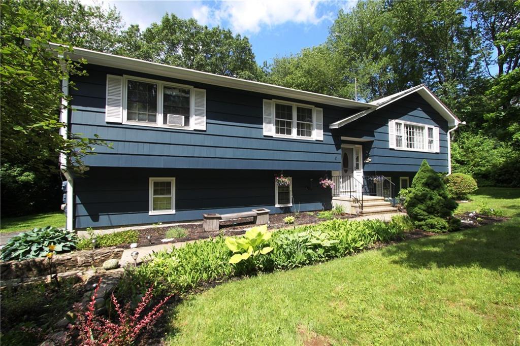 681 Booth Hill Road Trumbull, CT 06611 - Photo 1 of 1 a front view of a house with a yard and trees
