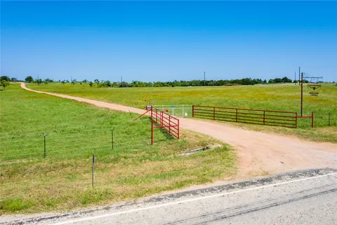 a view of a lake and a yard