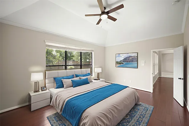 a bedroom with a large bed and a window