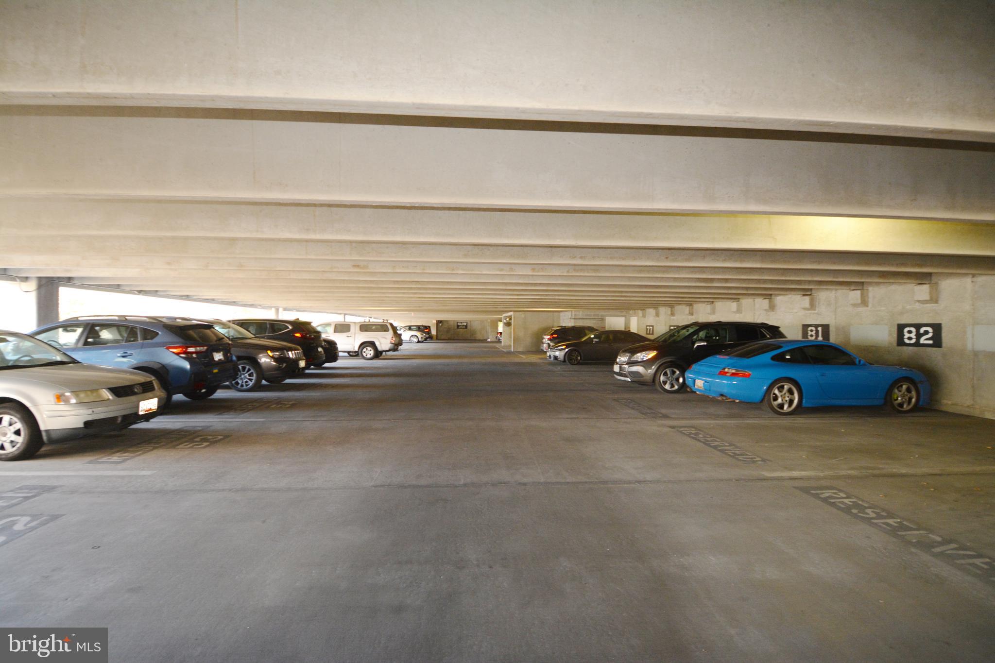 1201 East W Highway, Unit 238 Silver Spring, MD 20910 - Photo 7 of 18 a view of parking garage with cars