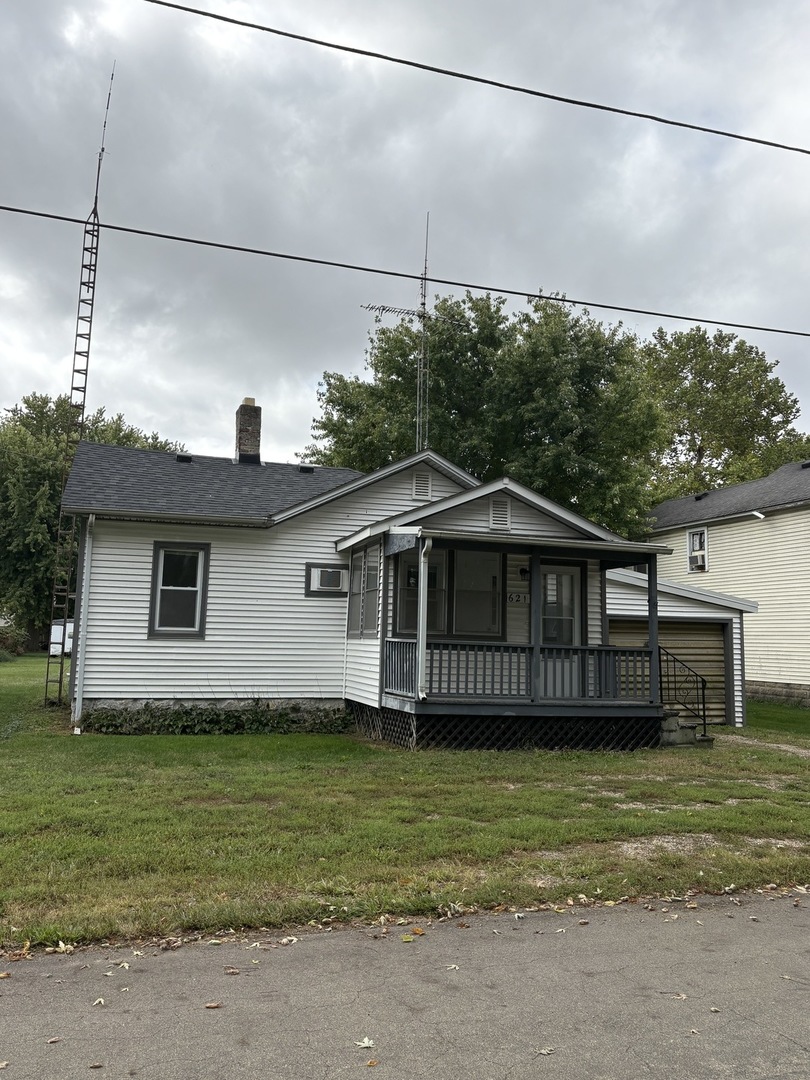 621 West Winthrop Street Earlville, IL 60518 - Photo 1 of 11 a front view of a house with a garden