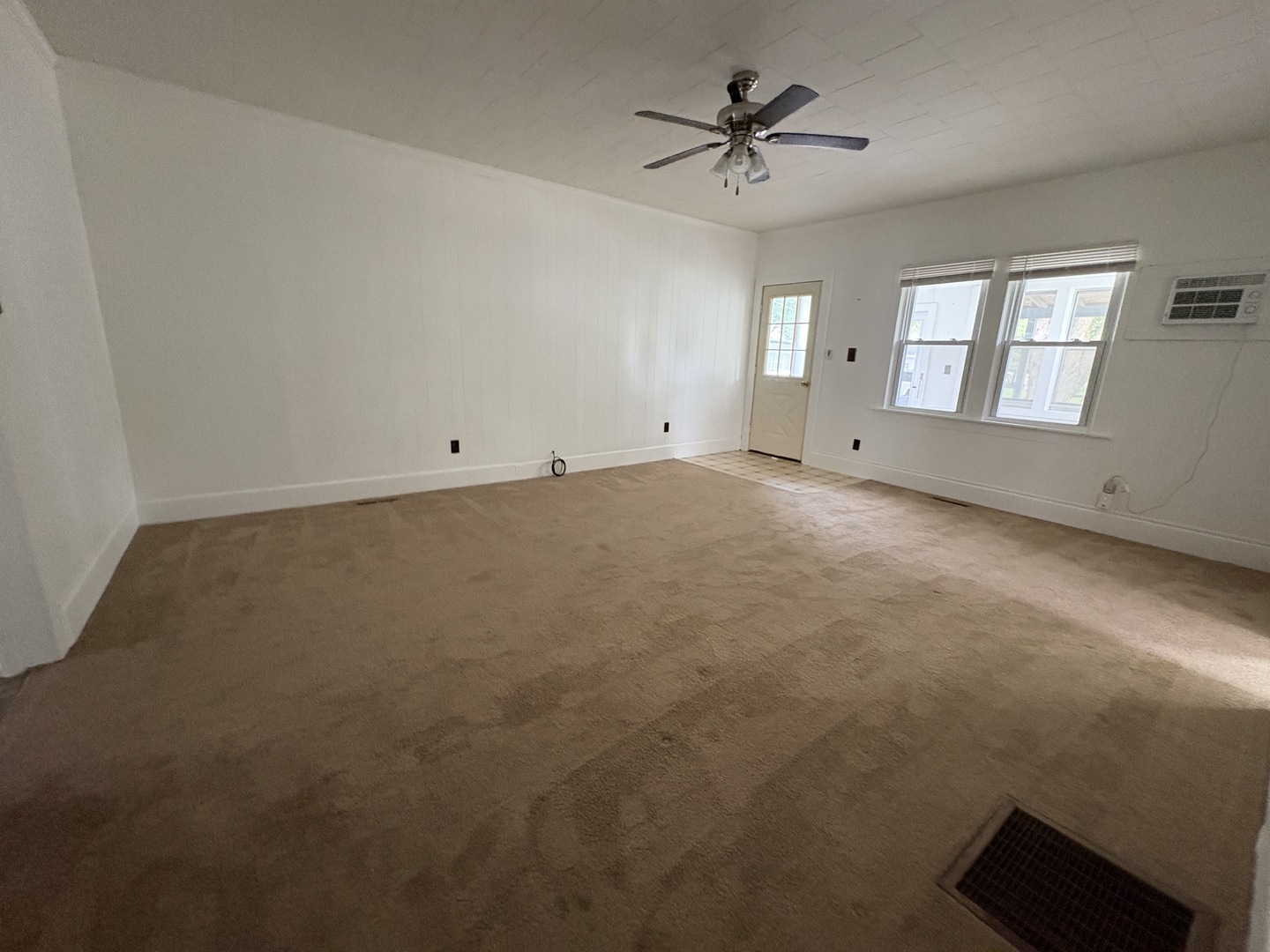 621 West Winthrop Street Earlville, IL 60518 - Photo 4 of 11 a view of an empty room with a window