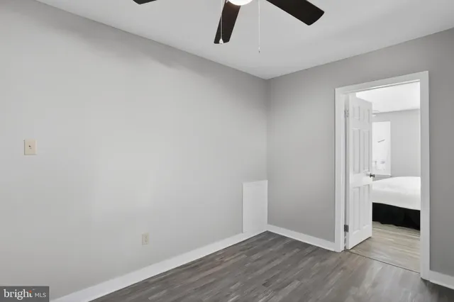 a view of a room with wooden floor and closet