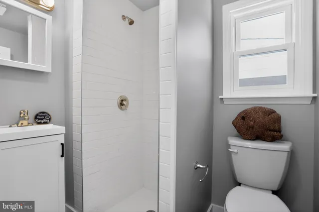 a bathroom with a toilet and a sink