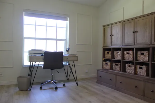 a bathroom with a sink vanity mirror and toilet