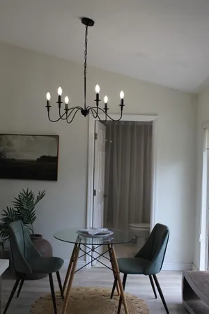 a view of a livingroom with furniture and a window
