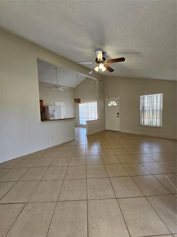 8290 Butterfield Lane Boca Raton, FL 33433 - Photo 25 of 38 a view of a livingroom with a ceiling fan and window