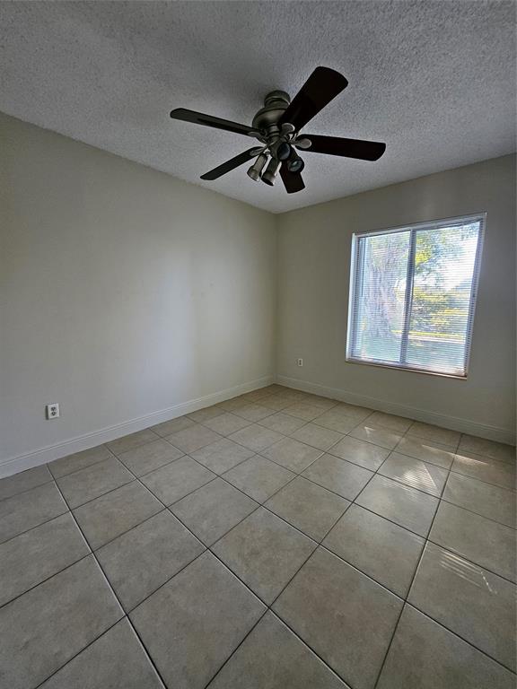 8290 Butterfield Lane Boca Raton, FL 33433 - Photo 32 of 38 a view of an empty room and window